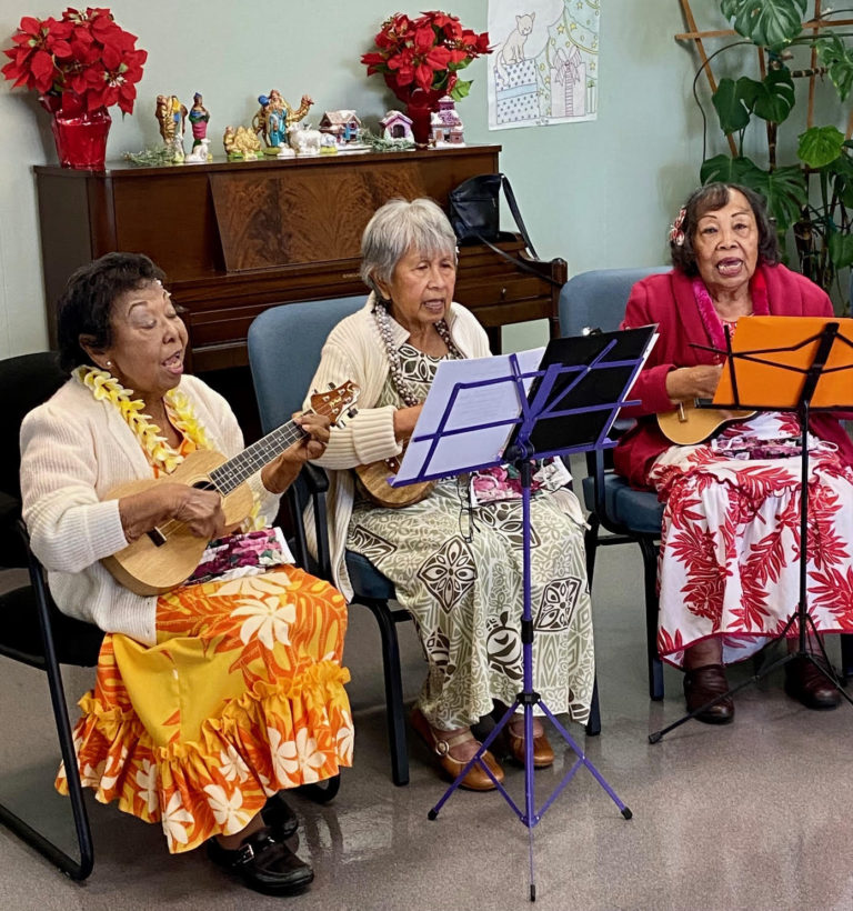 The City’s Hawaiian group performs ukulele songs for other older adults.