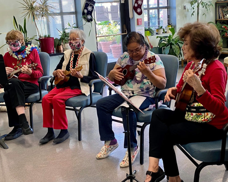 The City’s Hawaiian group performs ukulele songs for other older adults.