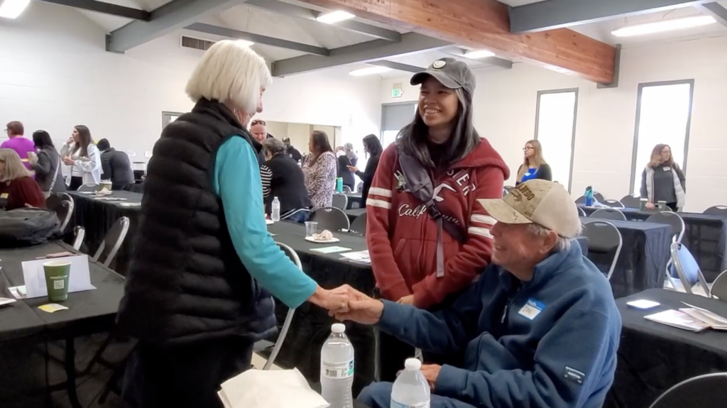 Light Up Your Health participants greeting ech other at the event