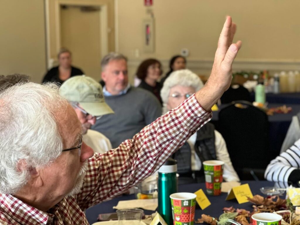 Light Up Your Life Brisbane Event 2025 - Participants raising hands in engagement